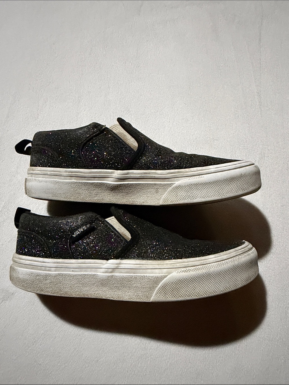 Vans Glitter Slip-On Sneakers in Black and White